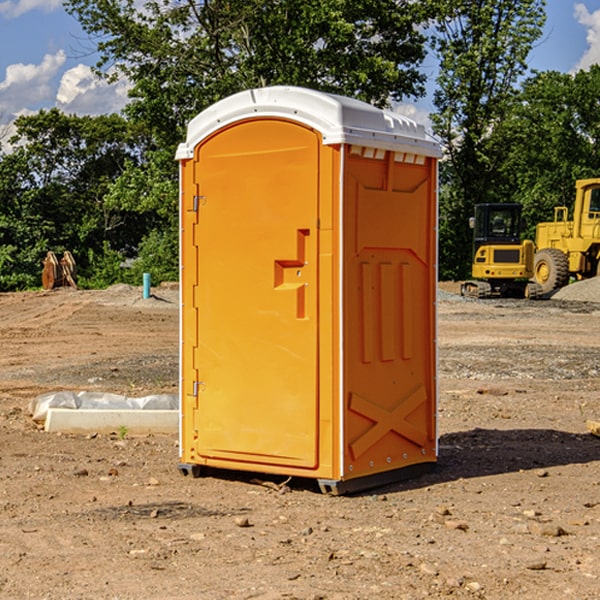 what is the cost difference between standard and deluxe portable restroom rentals in Grain Valley